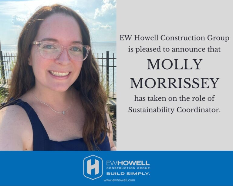 A woman with long brown hair and glasses smiles outdoors near a fence and water. Text announces Molly Morrissey as Sustainability Coordinator for EW Howell Construction Group, with company logo and website at the bottom.